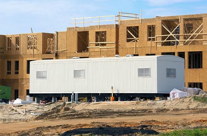 crane lifting modular building for construction office rentals in Blue Island, IL